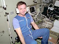 Yurii Gidzenko (ISS-1) communicating with ground controllers (NASA)