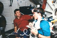 R. Sega and S. Krikalev work on a joint U.S./Russian metabolic experiment