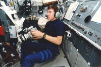 Cosmonaut Sergei Krikalev uses SAREX gear to talk to school children