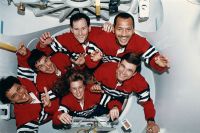 Portrait of STS-60 crew in tunnel connecting Shuttle to SPACEHAB