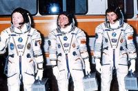 Soyuz TM-7 crew depart for launchpad